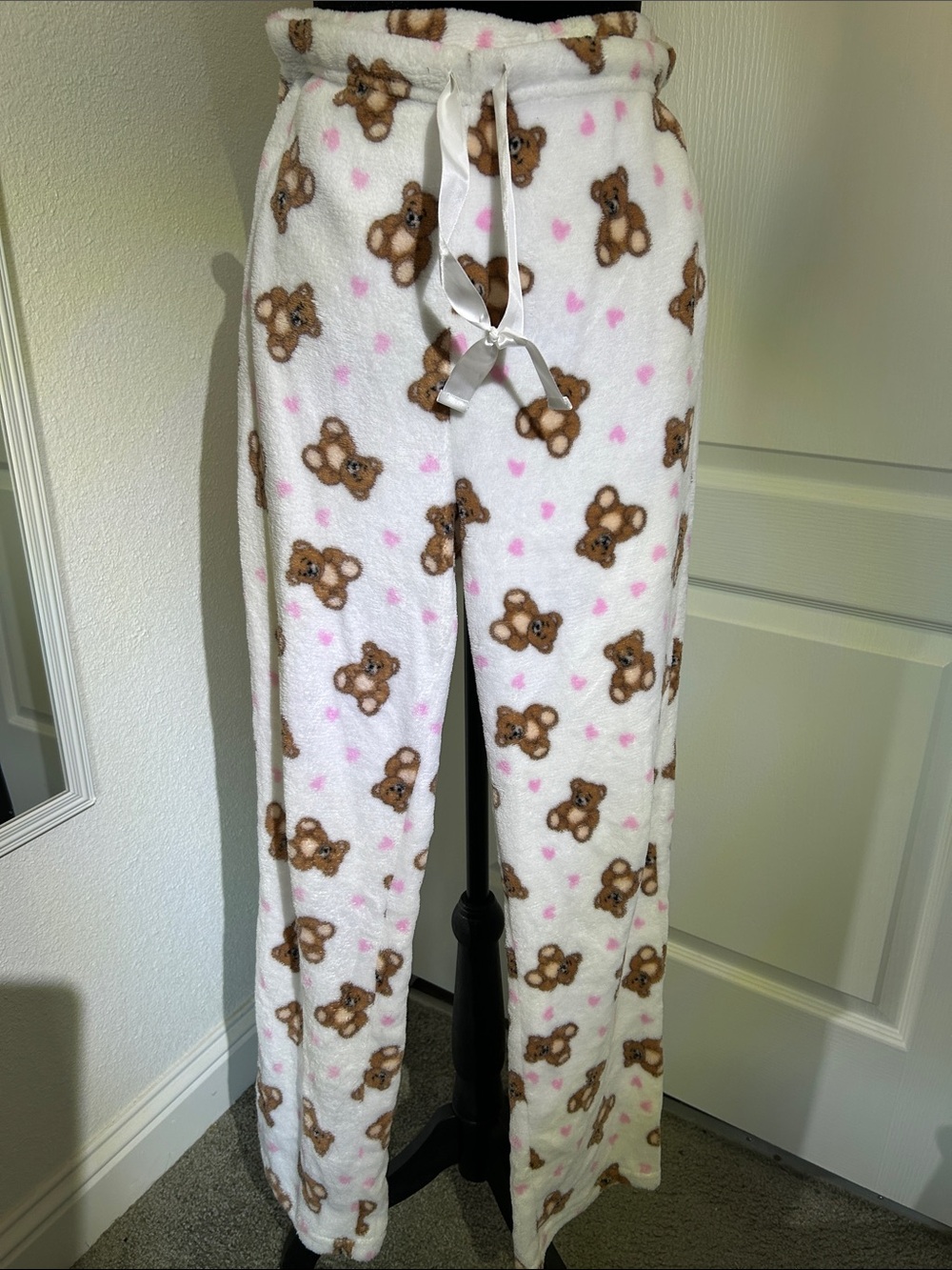 The cozy white plus lounge pants feature on all over brown teddy bear